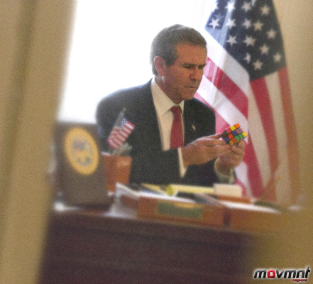 George W Bush tries to solve a Rummy Cube in the Oval Office - Photo by Alison Jackson